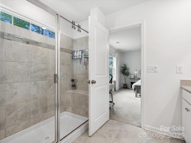 1008 Whipcord Dr, Waxhaw, NC 28173 - ensuite bathroom featuring vanity, a shower stall, and tile patterned floors