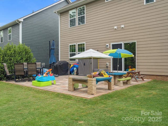 1008 Whipcord Dr, Waxhaw, NC 28173 - rear view of house with a patio area and a yard