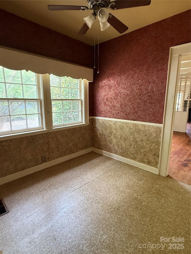 3985 1st Ave SW, Hickory, NC 28602 - unfurnished room featuring a ceiling fan, wallpapered walls, and carpet flooring