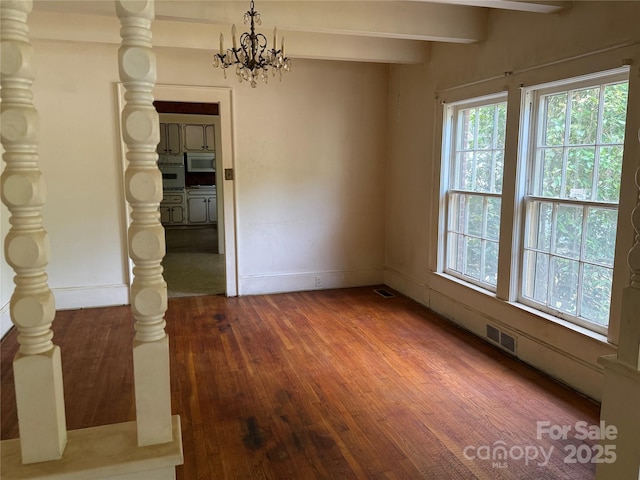 3985 1st Ave SW, Hickory, NC 28602 - unfurnished dining area featuring wood-type flooring, a chandelier, and beam ceiling