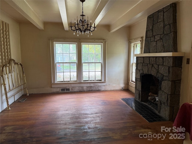 3985 1st Ave SW, Hickory, NC 28602 - unfurnished living room with beam ceiling, wood finished floors, a chandelier, and a stone fireplace