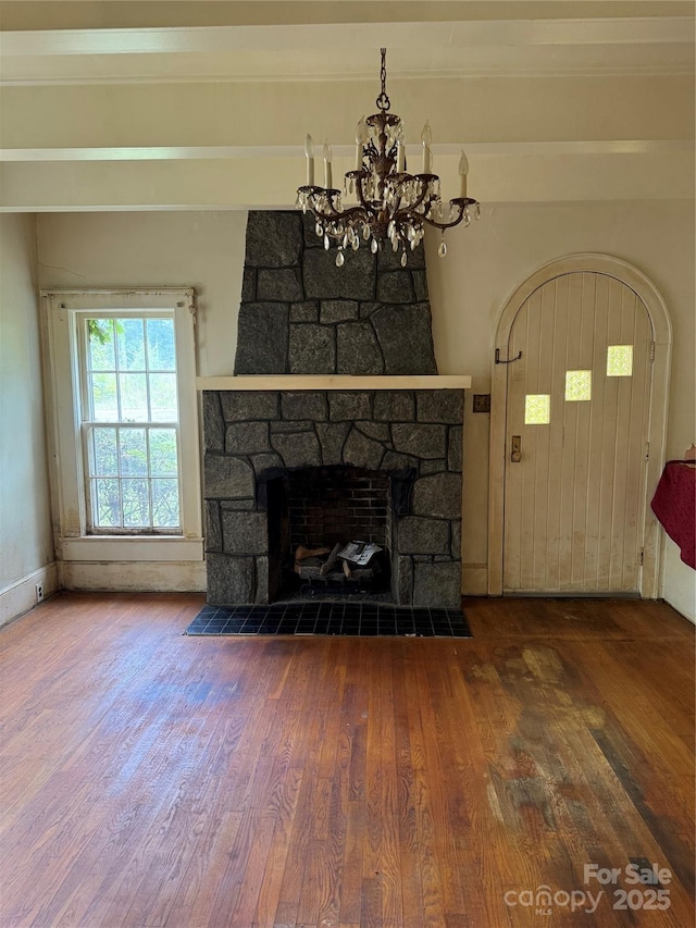 3985 1st Ave SW, Hickory, NC 28602 - unfurnished living room with wood finished floors and a chandelier