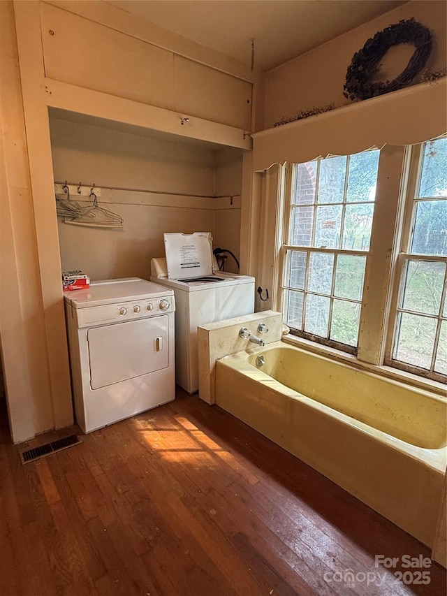 3985 1st Ave SW, Hickory, NC 28602 - laundry area with washing machine and dryer and wood finished floors