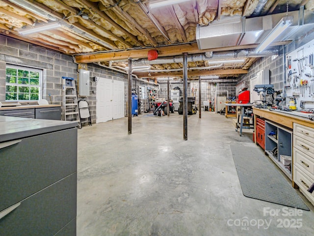 133 Sassafras Hill Dr, Rutherfordton, NC 28139 - below grade area with electric panel and a workshop area