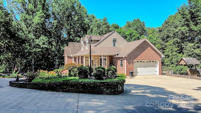 133 Sassafras Hill Dr, Rutherfordton, NC 28139 - traditional-style home featuring brick siding, a garage, concrete driveway, and a shingled roof