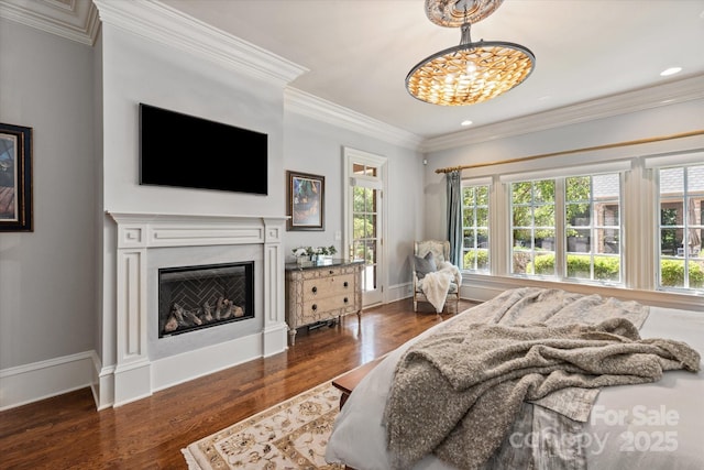 9110 Woodhall Lake Dr, Waxhaw, NC 28173 - bedroom with wood finished floors, a fireplace, crown molding, a chandelier, and recessed lighting