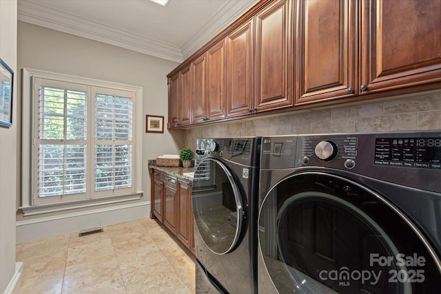 9110 Woodhall Lake Dr, Waxhaw, NC 28173 - laundry area featuring cabinet space, independent washer and dryer, and ornamental molding