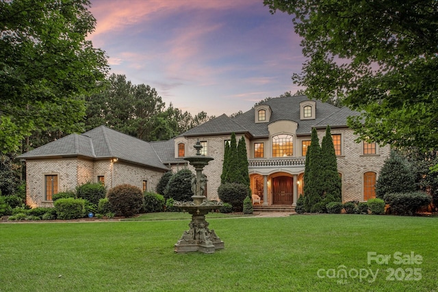 9110 Woodhall Lake Dr, Waxhaw, NC 28173 - french provincial home with brick siding and a front lawn