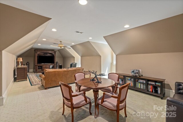 9110 Woodhall Lake Dr, Waxhaw, NC 28173 - dining room with light carpet, vaulted ceiling, and recessed lighting
