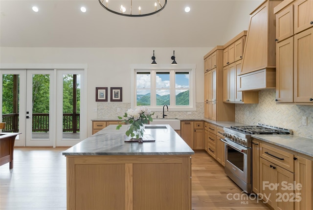48 Falling Leaves Ln, Hendersonville, NC 28792 - kitchen featuring stainless steel stove, custom range hood, plenty of natural light, light wood-type flooring, and recessed lighting