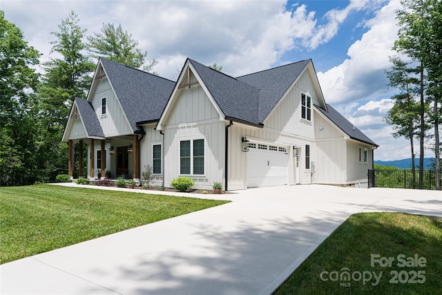 48 Falling Leaves Ln, Hendersonville, NC 28792 - modern farmhouse style home with roof with shingles, driveway, board and batten siding, and an attached garage