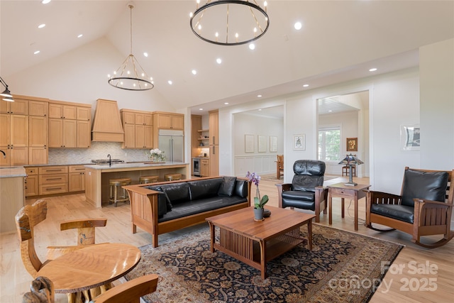 48 Falling Leaves Ln, Hendersonville, NC 28792 - living area with high vaulted ceiling, a chandelier, light wood finished floors, and recessed lighting
