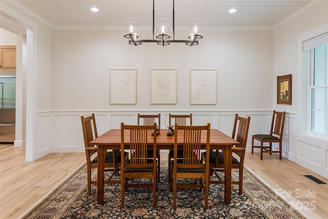 48 Falling Leaves Ln, Hendersonville, NC 28792 - dining space with light wood-style flooring, a decorative wall, ornamental molding, recessed lighting, and a chandelier