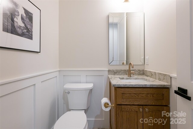 48 Falling Leaves Ln, Hendersonville, NC 28792 - bathroom featuring vanity, a wainscoted wall, and a decorative wall