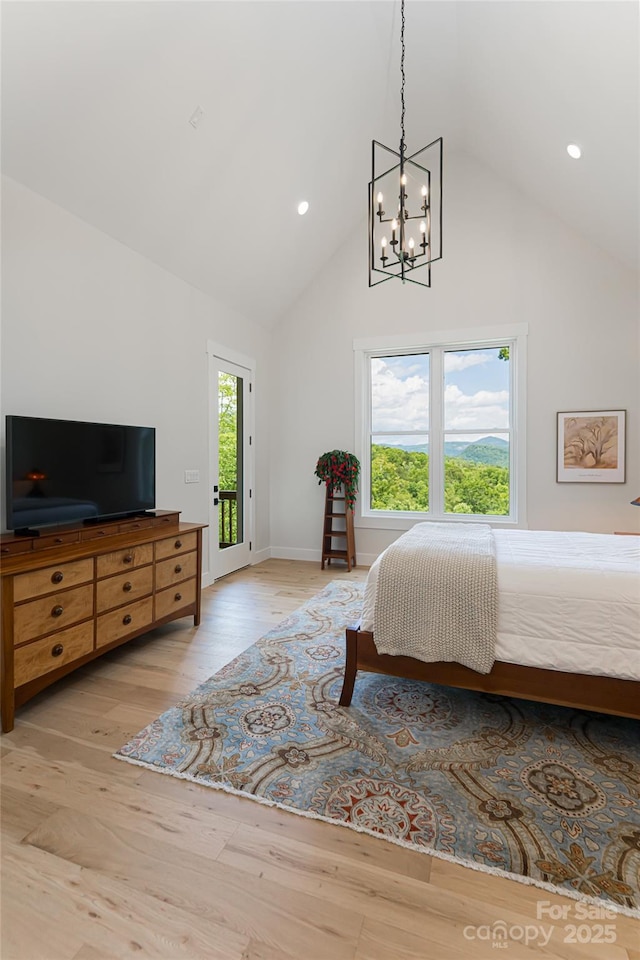 48 Falling Leaves Ln, Hendersonville, NC 28792 - bedroom featuring high vaulted ceiling, a chandelier, wood finished floors, recessed lighting, and access to exterior