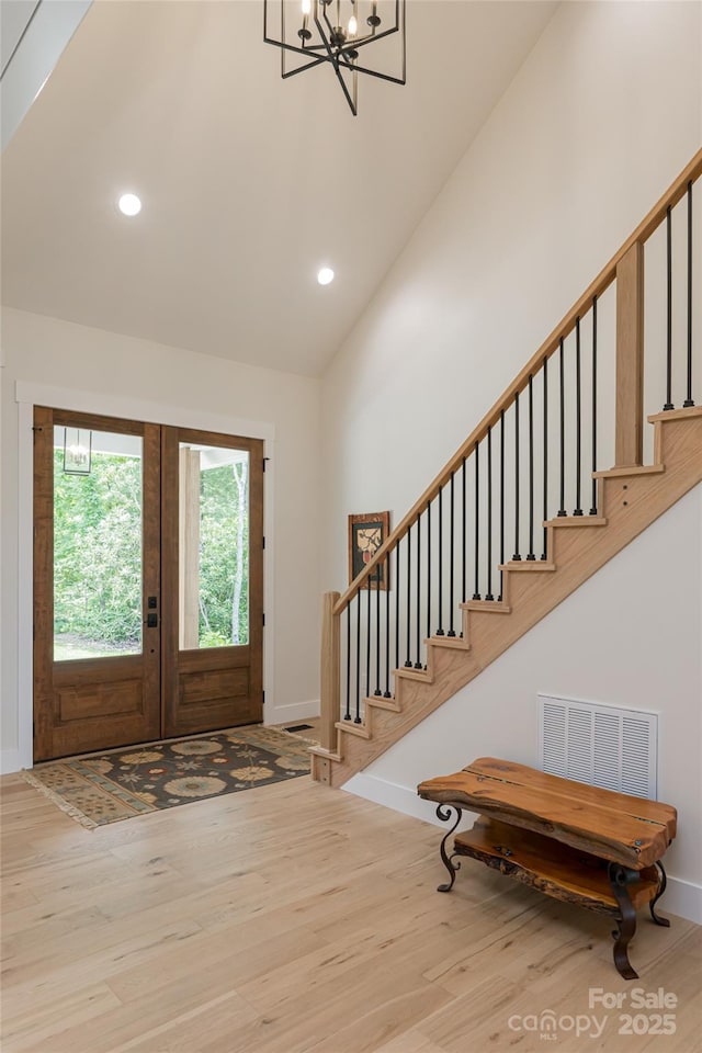 48 Falling Leaves Ln, Hendersonville, NC 28792 - entryway featuring wood finished floors, stairs, recessed lighting, a chandelier, and high vaulted ceiling