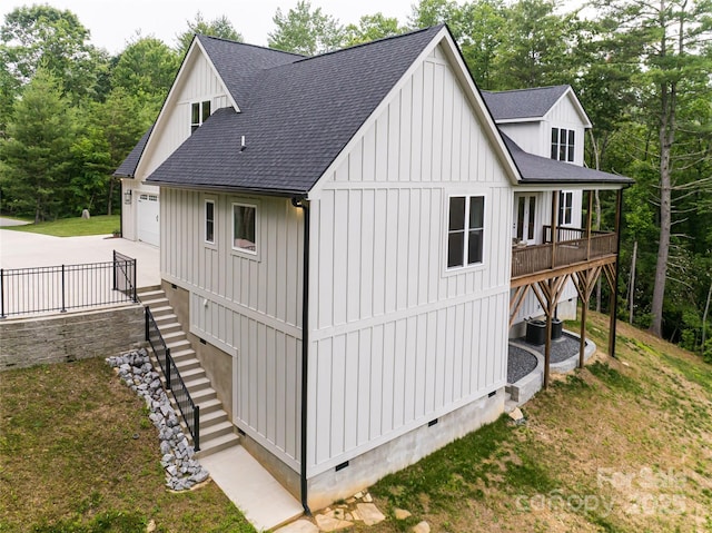 48 Falling Leaves Ln, Hendersonville, NC 28792 - view of outdoor structure with driveway, stairs, and view of wooded area