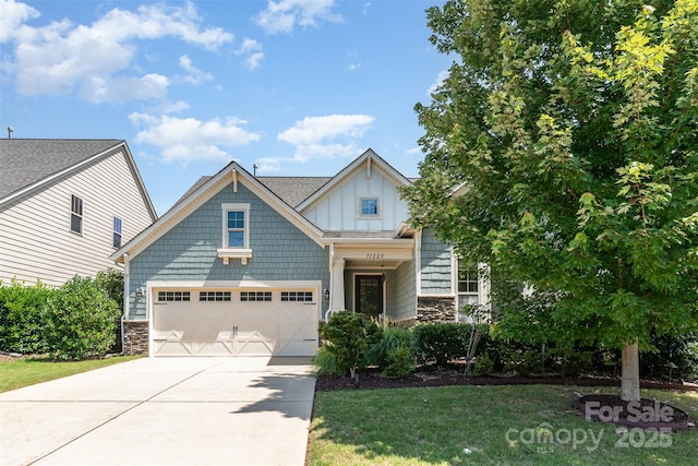 11225 Black Brant Ln, Charlotte, NC 28278 - craftsman inspired home with stone siding, driveway, board and batten siding, and a front lawn