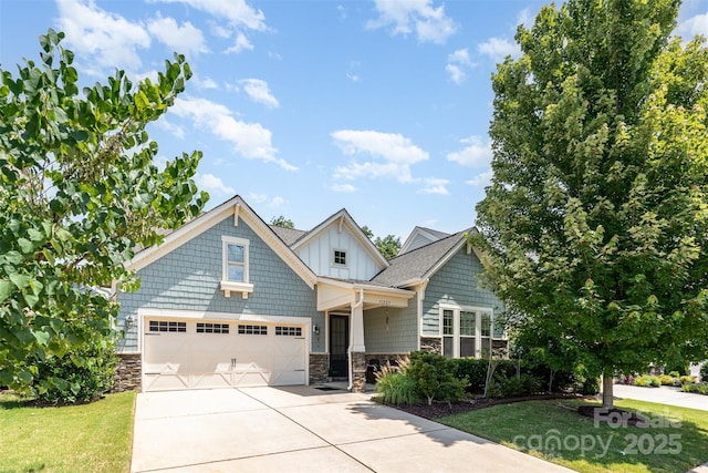 11225 Black Brant Ln, Charlotte, NC 28278 - view of front of home with stone siding, concrete driveway, a garage, and a front yard