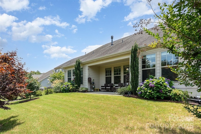 11225 Black Brant Ln, Charlotte, NC 28278 - rear view of house with a patio area and a shingled roof