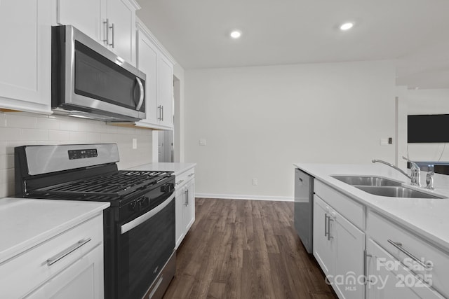2036 Vanderlyn St, Monroe, NC 28112 - kitchen featuring stainless steel appliances, backsplash, dark wood-style floors, white cabinetry, and recessed lighting