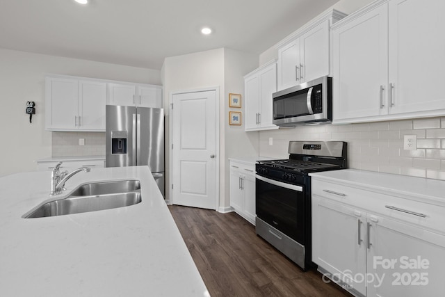 2036 Vanderlyn St, Monroe, NC 28112 - kitchen featuring appliances with stainless steel finishes, recessed lighting, white cabinets, backsplash, and dark wood-style floors