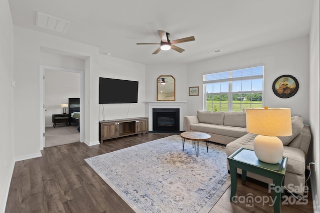 2036 Vanderlyn St, Monroe, NC 28112 - living area featuring ceiling fan, dark wood-style floors, and a glass covered fireplace
