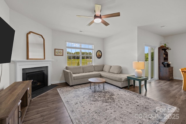 2036 Vanderlyn St, Monroe, NC 28112 - living area with ceiling fan, dark wood finished floors, and a fireplace with flush hearth
