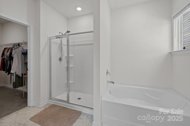 2036 Vanderlyn St, Monroe, NC 28112 - full bath featuring a stall shower, a garden tub, and a spacious closet