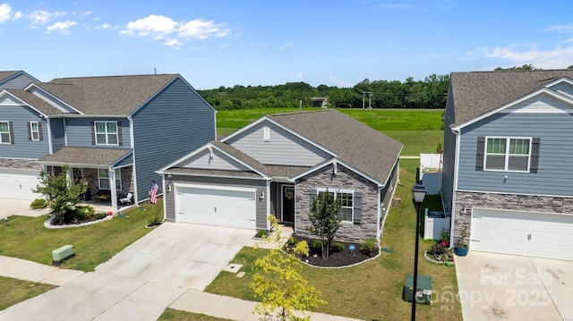 2036 Vanderlyn St, Monroe, NC 28112 - view of front of home featuring driveway, stone siding, and a front yard