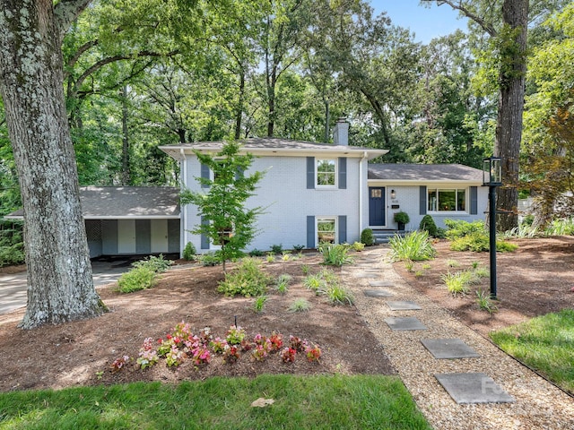 4618 Emory Ln, Charlotte, NC 28211 - tri-level home featuring a chimney, brick siding, and an attached carport