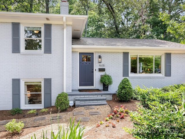 4618 Emory Ln, Charlotte, NC 28211 - view of front of house featuring a chimney and brick siding