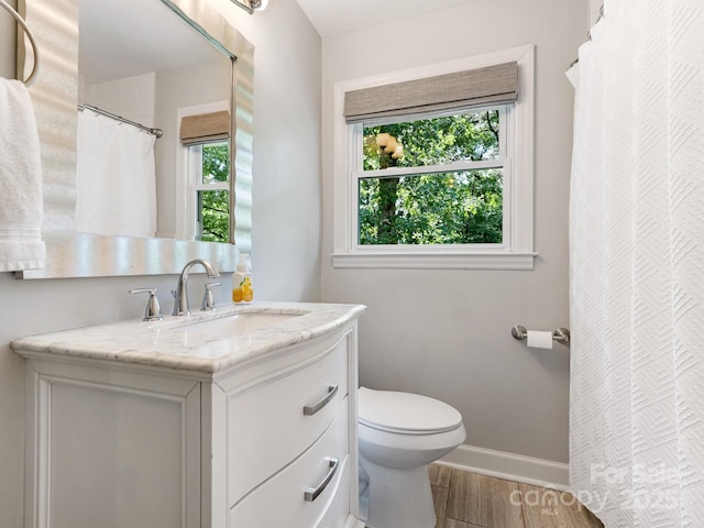4618 Emory Ln, Charlotte, NC 28211 - bathroom with vanity, wood finished floors, and a shower with curtain