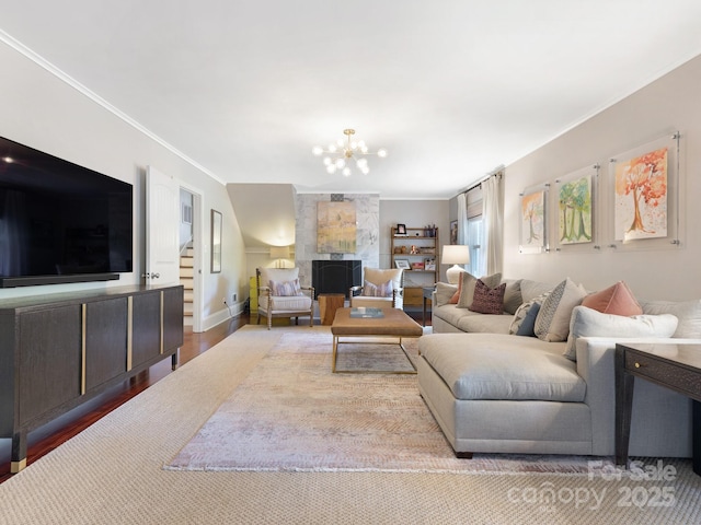 4618 Emory Ln, Charlotte, NC 28211 - living area featuring crown molding, wood finished floors, and a chandelier