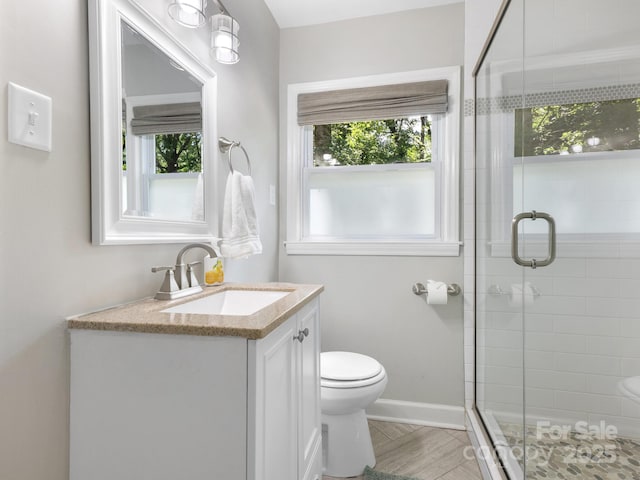 4618 Emory Ln, Charlotte, NC 28211 - bathroom with plenty of natural light, vanity, and a stall shower