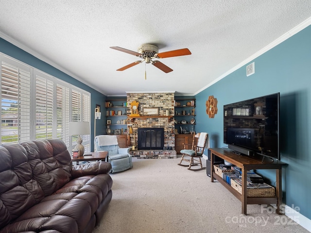 409 E 18th St, Kannapolis, NC 28083 - living room with ornamental molding, a ceiling fan, carpet floors, a textured ceiling, and a fireplace