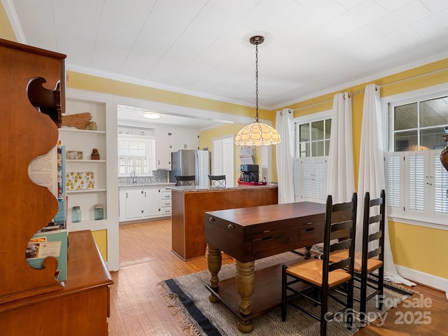 409 E 18th St, Kannapolis, NC 28083 - dining room featuring ornamental molding and light wood finished floors