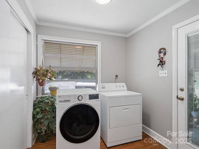 409 E 18th St, Kannapolis, NC 28083 - washroom with washer and clothes dryer, wood finished floors, and crown molding