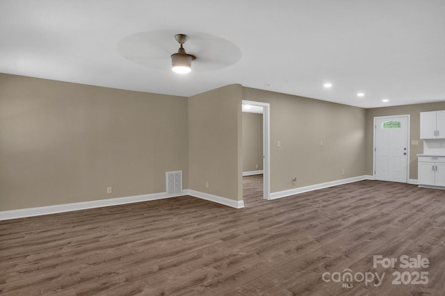6208 Karenstone Dr, Charlotte, NC 28215 - spare room with a ceiling fan, dark wood-style floors, and recessed lighting