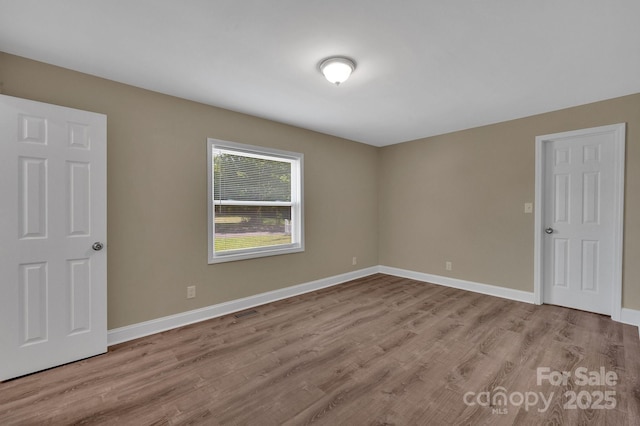 6208 Karenstone Dr, Charlotte, NC 28215 - spare room with wood finished floors