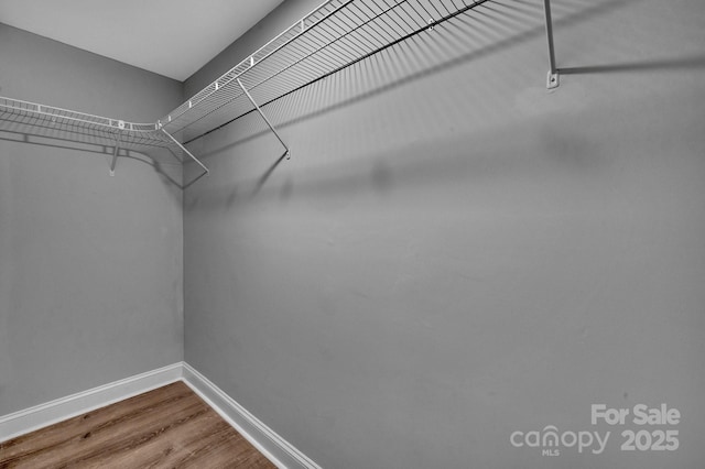 6208 Karenstone Dr, Charlotte, NC 28215 - spacious closet with wood finished floors