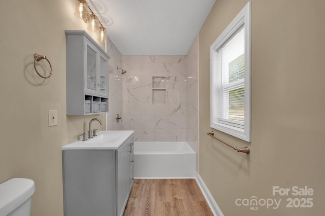 6208 Karenstone Dr, Charlotte, NC 28215 - bathroom featuring vanity, wood finished floors, and shower / washtub combination