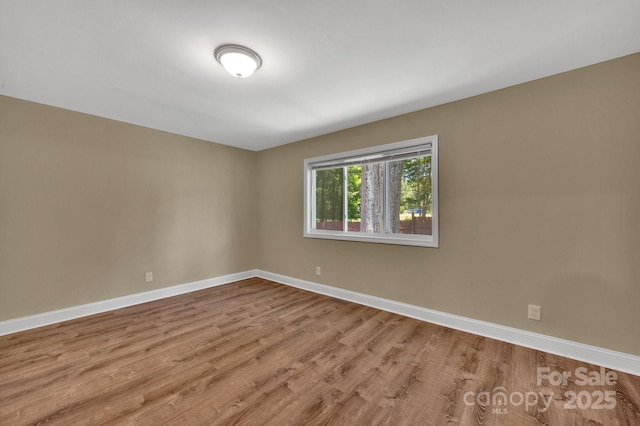 6208 Karenstone Dr, Charlotte, NC 28215 - empty room featuring wood finished floors and baseboards