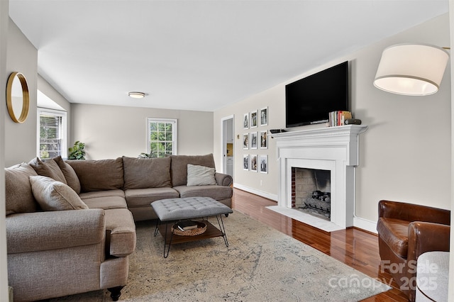 601 Pennell St NE, Lenoir, NC 28645 - living room featuring a fireplace with flush hearth and wood finished floors