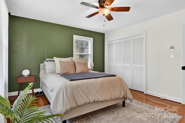 601 Pennell St NE, Lenoir, NC 28645 - bedroom featuring wood finished floors, a closet, and a ceiling fan