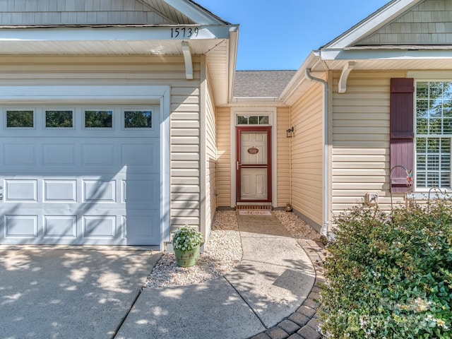 15739 Circlegreen Dr, Charlotte, NC 28273 - doorway to property featuring a garage and a shingled roof