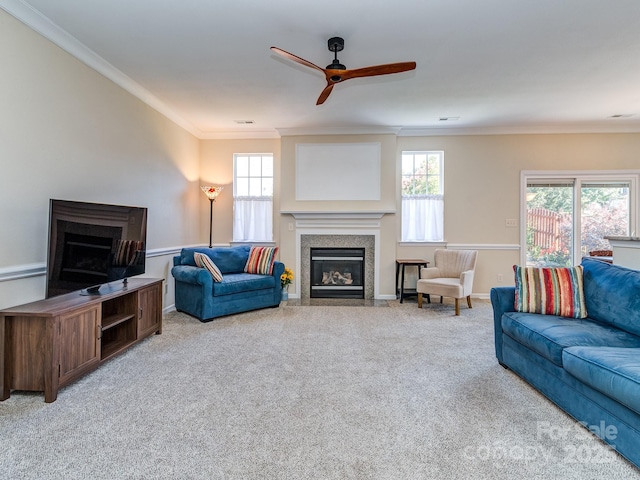 15739 Circlegreen Dr, Charlotte, NC 28273 - carpeted living area featuring a fireplace with flush hearth, ceiling fan, and crown molding
