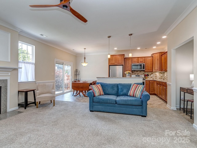 15739 Circlegreen Dr, Charlotte, NC 28273 - living room featuring light carpet, ceiling fan, ornamental molding, recessed lighting, and a high end fireplace