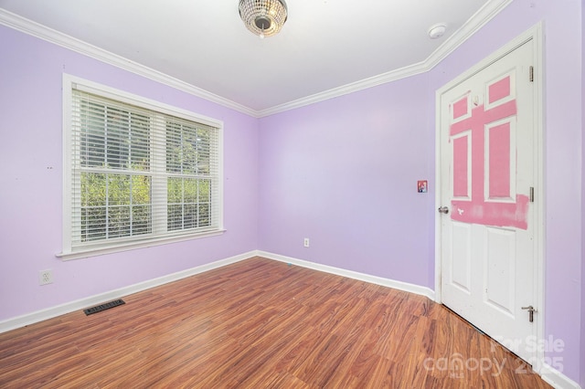 610 Mountain Pl, Albemarle, NC 28001 - empty room with wood finished floors, crown molding, and a smoke detector