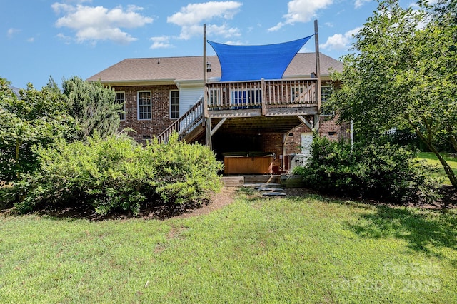 610 Mountain Pl, Albemarle, NC 28001 - back of property with a hot tub, a wooden deck, a yard, and brick siding